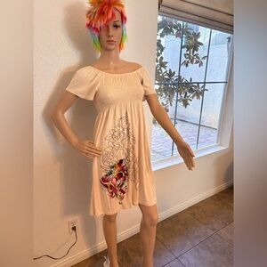 Chic Cream Midi Dress with Artistic Floral Accents can be worn off the shoulders